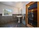 Classic bathroom with pedestal sink, tiled walls and floors, and a glass-enclosed shower stall at 32453 Upper Bear Creek Rd, Evergreen, CO 80439