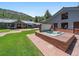 Exterior view of an in-ground hot tub at 32453 Upper Bear Creek Rd, Evergreen, CO 80439