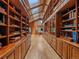 Bright library featuring hardwood floors, skylights, and built-in wooden bookshelves at 32453 Upper Bear Creek Rd, Evergreen, CO 80439