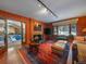 Inviting living room with fireplace and access to an indoor swimming pool area at 32453 Upper Bear Creek Rd, Evergreen, CO 80439