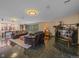 Spacious living room features a marble fireplace, elegant lighting and sleek marble floors at 32453 Upper Bear Creek Rd, Evergreen, CO 80439