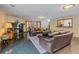 Open living room boasting fireplace, sleek floors and access to other rooms at 32453 Upper Bear Creek Rd, Evergreen, CO 80439