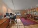 Spacious office with wood floors, built in shelving, and track lighting at 32453 Upper Bear Creek Rd, Evergreen, CO 80439