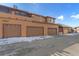 Multi-car garage with 4 garage door bays and parking spaces available at 8643 Gold Peak Dr # E, Highlands Ranch, CO 80130