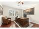 Comfortable office space featuring hardwood floors, natural lighting, and a lovely desk at 8643 Gold Peak Dr # E, Highlands Ranch, CO 80130