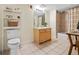 Bright bathroom showcasing tile floors, a vanity with drawers, tub, and shower combo at 2901 N Wyandot St # 19, Denver, CO 80211