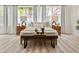 Bedroom with windows, two end tables with lamps and a bench at the foot of the bed at 2901 N Wyandot St # 19, Denver, CO 80211