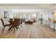 A bright open-concept bedroom includes a dining area and a desk near a door at 2901 N Wyandot St # 19, Denver, CO 80211