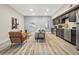 Bright living room with modern kitchen, stylish seating, and plenty of natural light at 2901 N Wyandot St # 19, Denver, CO 80211