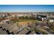 Scenic neighborhood view showcasing a sports field, homes, and lush greenery at 2901 N Wyandot St # 19, Denver, CO 80211
