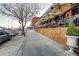 Charming outdoor dining area with shade and a view of the neighborhood street at 2901 N Wyandot St # 19, Denver, CO 80211