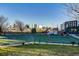 Community basketball court with city skyline in the background, perfect for recreation at 2901 N Wyandot St # 19, Denver, CO 80211