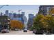 Picturesque street view with autumn trees and a glimpse of the city skyline at 2901 N Wyandot St # 19, Denver, CO 80211