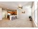 Inviting living area with seamless flow into kitchen and great natural light at 6745 S Winnipeg Cir # 103, Aurora, CO 80016