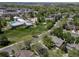 Aerial view of the neighborhood featuring a pool, clubhouse and park with tennis courts at 12663 S Silver Creek Ct, Parker, CO 80134