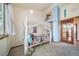 Bright, carpeted bedroom with a fun canopy bed, large window and built in shelving at 12663 S Silver Creek Ct, Parker, CO 80134