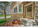 Close-up of front porch featuring stone accents and a welcoming entryway at 12663 S Silver Creek Ct, Parker, CO 80134