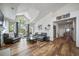 Open living area with vaulted ceilings, cozy seating, and large windows for natural light at 12663 S Silver Creek Ct, Parker, CO 80134