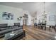 Open-concept living space showcases seamless flow between living and dining areas with stylish flooring at 12663 S Silver Creek Ct, Parker, CO 80134