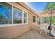 Outdoor patio with a table, chairs, and a sun umbrella on a sunny day, offering serene views at 12663 S Silver Creek Ct, Parker, CO 80134