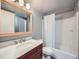 Bathroom features a vanity with a sink, large mirror and a shower with curtain at 2740 W 86Th Ave # 178, Westminster, CO 80031