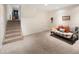 Spacious basement provides a cozy seating area and stairs to the upper level at 6385 S Jay Way, Littleton, CO 80123