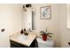Cozy bathroom featuring a stylish vanity with a bowl sink and a neutral color scheme at 6385 S Jay Way, Littleton, CO 80123