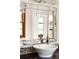 Stylish bathroom featuring a modern faucet, vessel sink, and a mosaic tile countertop at 6385 S Jay Way, Littleton, CO 80123