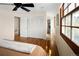 Spacious bedroom with wood floors, closet, and large window offering natural light at 6385 S Jay Way, Littleton, CO 80123