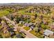 Neighborhood aerial view showcasing well-manicured lawns and mature trees along a quiet street at 6385 S Jay Way, Littleton, CO 80123