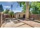 Private backyard with brick patio and small brick building perfect for outdoor entertaining at 575 N Marion St, Denver, CO 80218