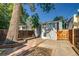 Charming backyard with mature trees and concrete patio at 575 N Marion St, Denver, CO 80218