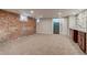 Expansive bedroom features an exposed brick wall and leads to a bathroom at 575 N Marion St, Denver, CO 80218