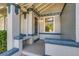 Charming front porch with seating and decorative details, adding curb appeal at 575 N Marion St, Denver, CO 80218