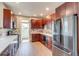 Modern kitchen boasts wood cabinets, marble countertops, and new stainless steel appliances at 575 N Marion St, Denver, CO 80218