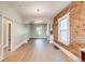 Spacious living room featuring exposed brick, lots of natural light, and an open floor plan at 575 N Marion St, Denver, CO 80218