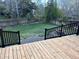Beautiful backyard featuring a new deck and large, green lawn, perfect for outdoor activities and relaxation at 10935 Acadia, Parker, CO 80138