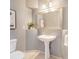 Half-bathroom with pedestal sink and neutral paint at 10935 Acadia, Parker, CO 80138