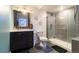 Modern bathroom featuring sleek vanity, toilet, and glass-enclosed shower at 10935 Acadia, Parker, CO 80138
