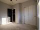 Spacious bedroom with closet, neutral walls, and door leading to hallway at 10935 Acadia, Parker, CO 80138