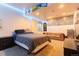 Bedroom with bed, couch and mounted C4 and Monster energy decor at 10935 Acadia, Parker, CO 80138