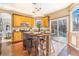 Eat-in kitchen island with seating and an adjacent slider to the back deck at 10935 Acadia, Parker, CO 80138