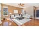 Cozy living room with fireplace, artwork, and hardwood floors at 10935 Acadia, Parker, CO 80138
