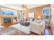Comfortable living room with fireplace and lots of windows at 10935 Acadia, Parker, CO 80138