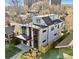 Aerial view of a modern home featuring a rooftop deck and contemporary design within a residential neighborhood at 357 S Franklin St, Denver, CO 80209