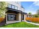 The backyard offers a covered patio and verdant lawn, ideal for outdoor enjoyment at 357 S Franklin St, Denver, CO 80209