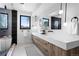 Light filled bathroom with marble countertop, wood vanity, and modern globe pendant lighting at 357 S Franklin St, Denver, CO 80209