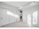 Bedroom with sliding closet doors and doorway to the staircase of the house at 357 S Franklin St, Denver, CO 80209