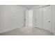 Bright bedroom featuring neutral carpet, white walls, closet, and ample natural light at 357 S Franklin St, Denver, CO 80209