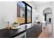 Stylish countertop with a small beverage refrigerator, drawers, decor, and view from the window at 357 S Franklin St, Denver, CO 80209